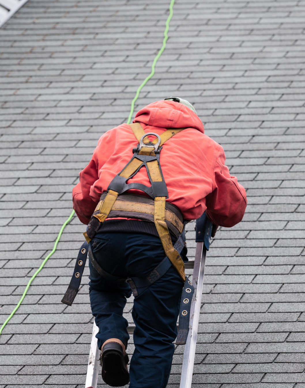 man working on a roof